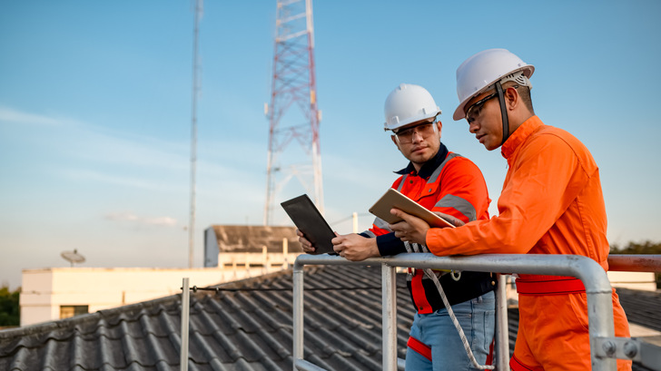 Two engineers are planning to install solar cells on the roof of a building.