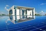 Photovoltaik in Regierungsviertel | A German rooftop array with the German Chancellery in the background. The country has so much of solar installed that new grid integration rules have become necessary.